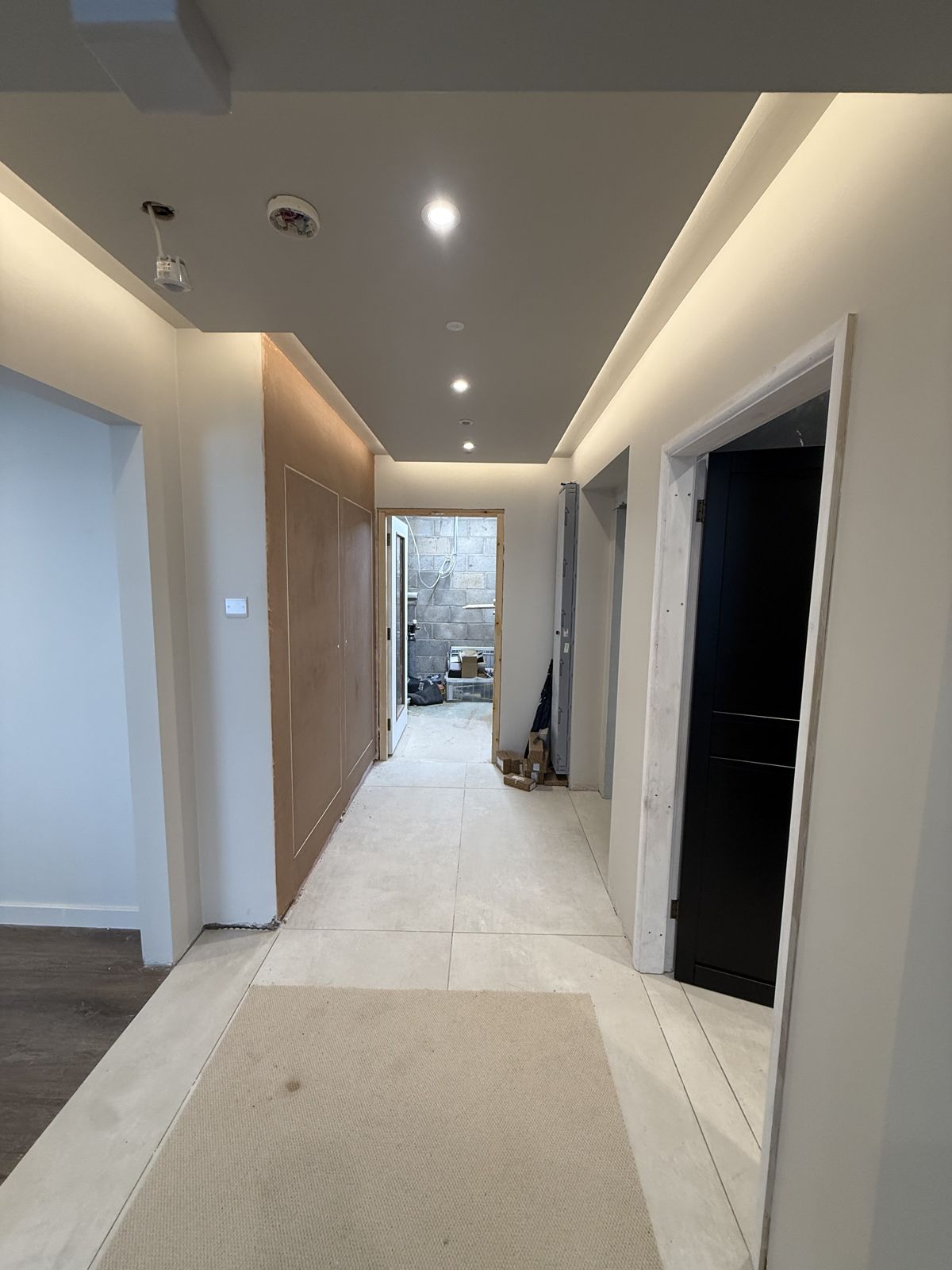 Hallway with downlights and LED strip lighting